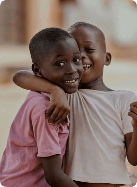 Two children embracing and smiling